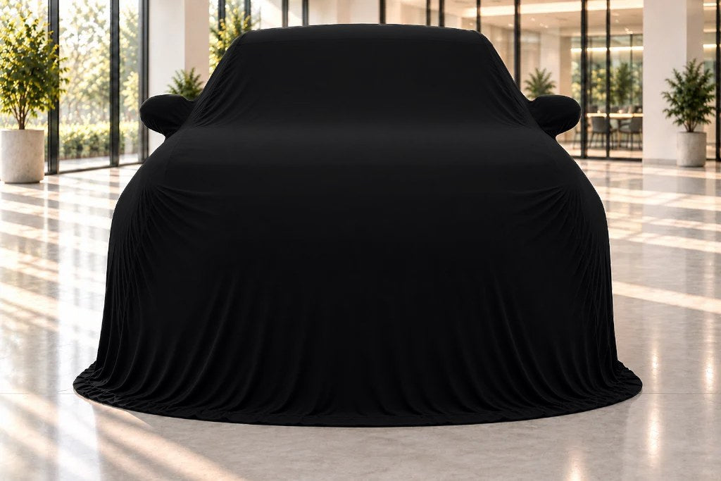 A black velvet Showroom Reveal over an SUV in a showroom